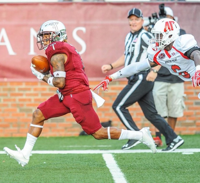 Hiram Velez breaking away with the ball for Troy.