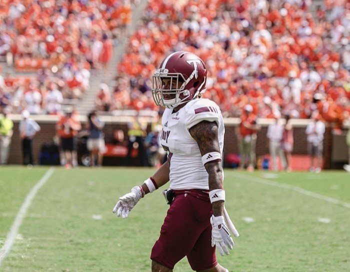 Hiram Velez on the field at Clemson in a Troy away uniform.
